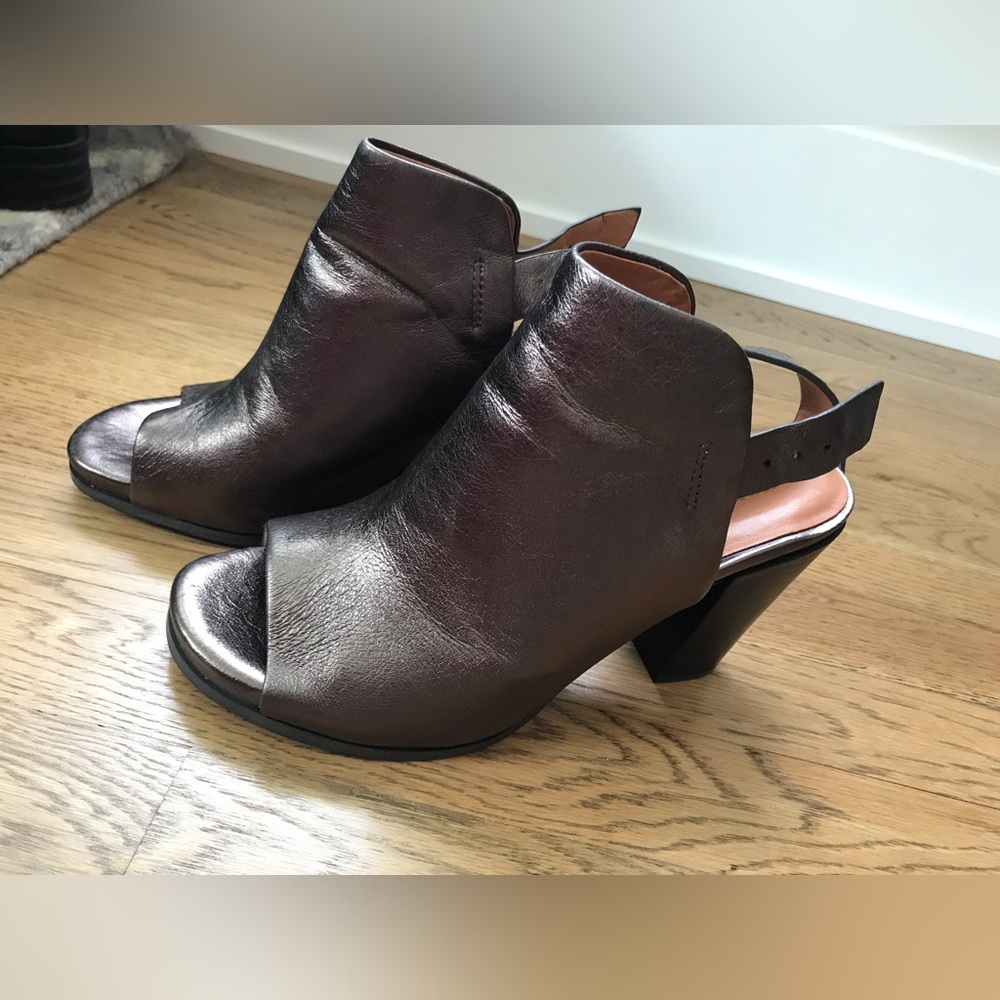 Bronze colored leather platform heels. NWOT